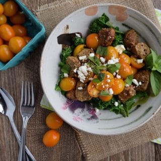 A Kale and Tomato Power Bowl with feta and tomatoes.