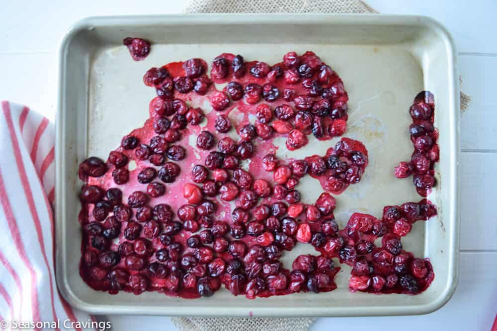 Roasted Maple Sweet Potatoes with Cranberries on a sheet pan