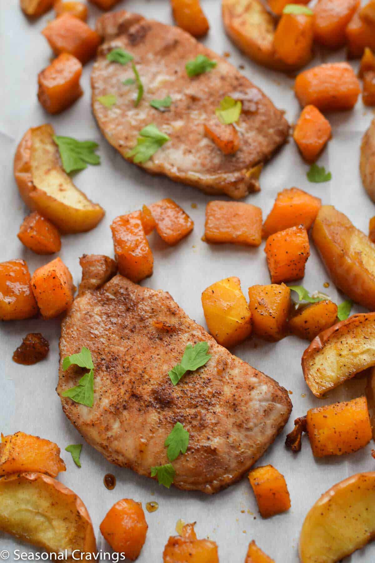 Sheet Pan Brown Sugar Pork Chops on parchment paper close up