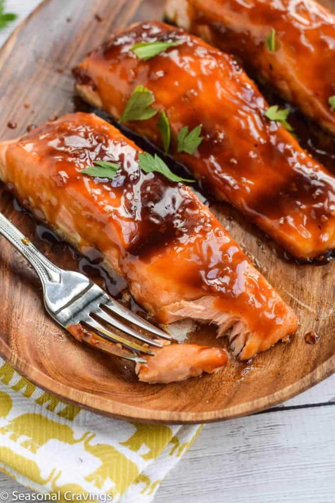 teriyaki salmon on a brown plate