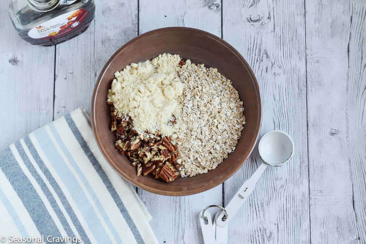 Ingredients for sweet potato crumb topping in small brown bowl