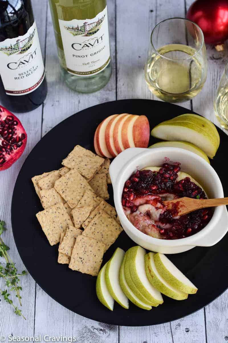 Pomegranate Cranberry Baked Brie is the perfect sweet and salty appetizer for any party.