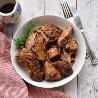 Instant Pot pork tenderloin in a white bowl.