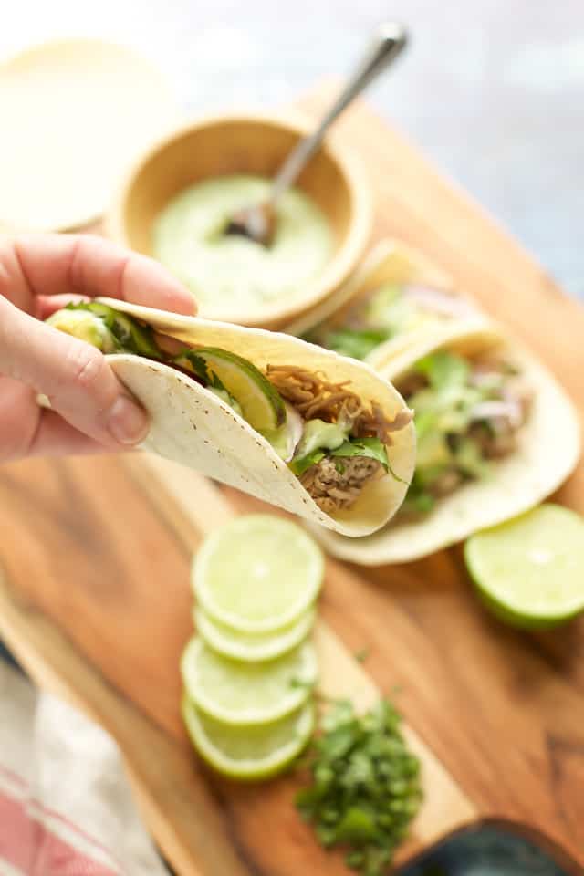 pork tenderloin tacos instant pot in someones hand