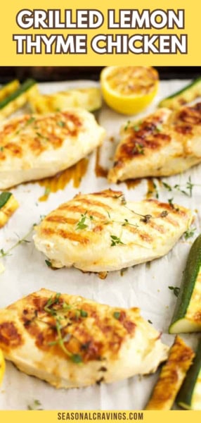 Grilled lemon thyme chicken breasts garnished with fresh thyme and served with zucchini slices on a platter. The text "Grilled Lemon Thyme Chicken" is at the top. Enjoy the exquisite flavor of our signature grilled lemon thyme chicken today!