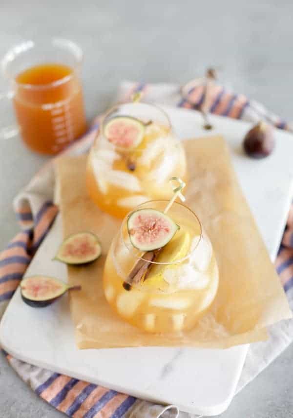 vodka apple cider cocktail with figs and fresh cinnamon sticks