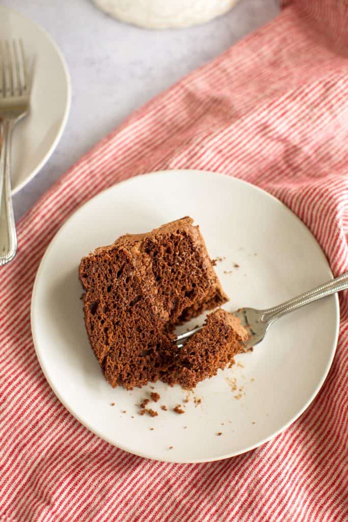 best gluten free chocolate cake slice on a white plate