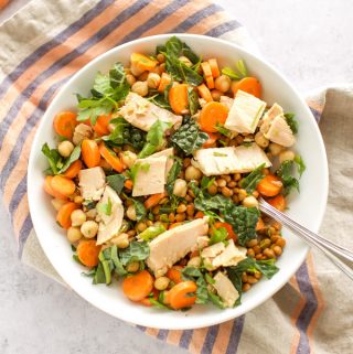 A bowl of lentil salad with chickpeas.