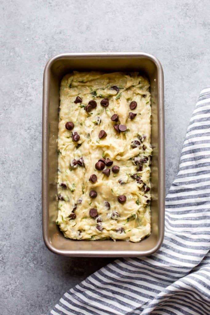 gluten free zucchini bread in a loaf pan uncooked with chocolate chips