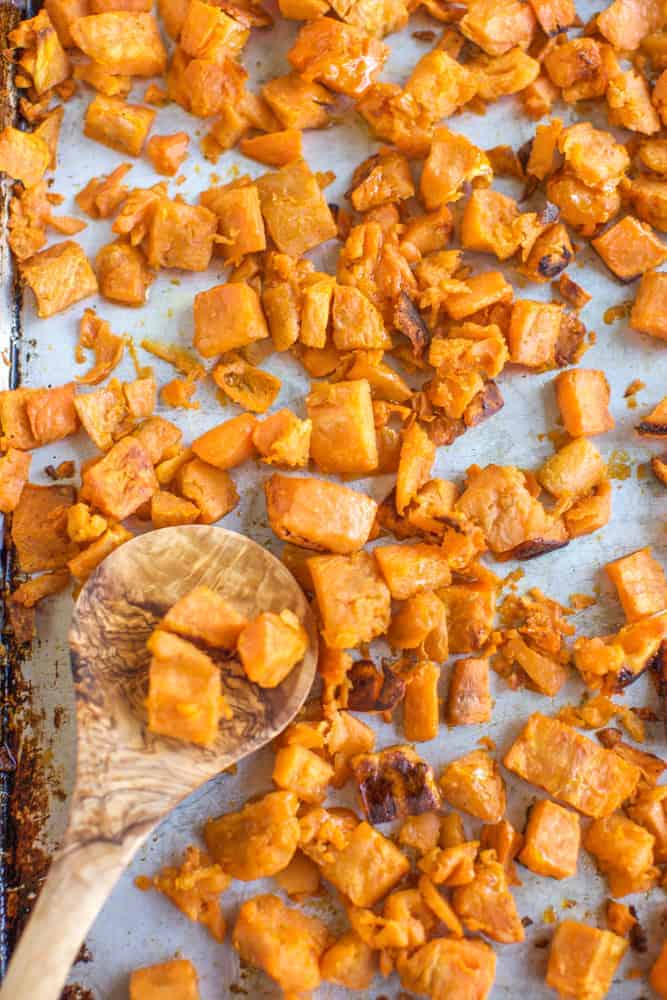 oven roasted sweet potato recipe with a spoon