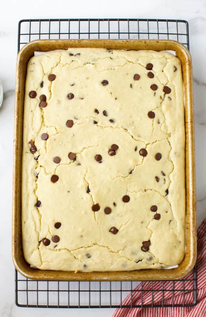 gluten free sheet pan pancakes in a sheet pan on a cooling rack