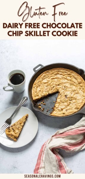 A skillet with a partially sliced gluten-free, dairy-free chocolate chip cookie, served with a slice on a plate, a fork, a cup of black coffee, and a folded cloth napkin on the side.