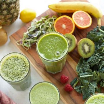 four green smoothies in glasses