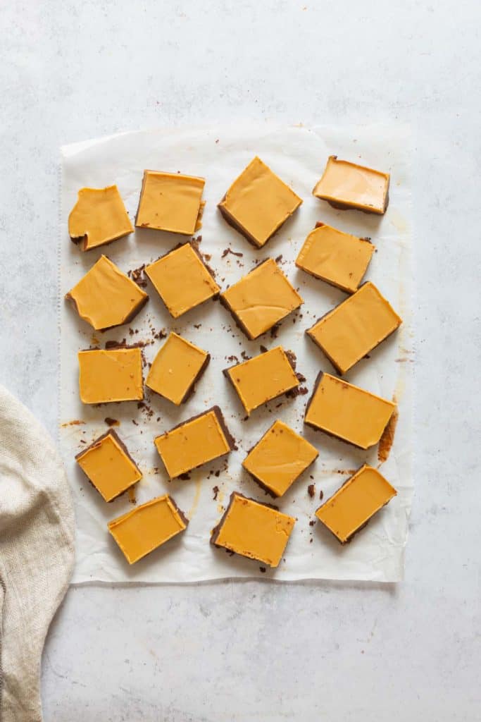 pieces of peanut butter fudge before the chocolate drizzle is added