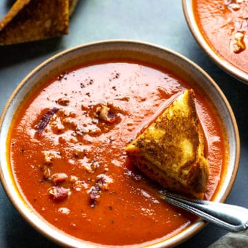 tomato soup in a bowl with a spoon