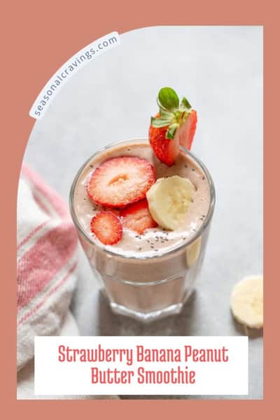 A glass of strawberry banana peanut butter smoothie garnished with sliced strawberries, bananas, and chia seeds. The text reads "Strawberry Banana Peanut Butter Smoothie.