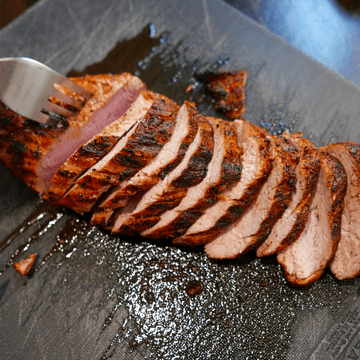 Baked pork tenderloin sliced.