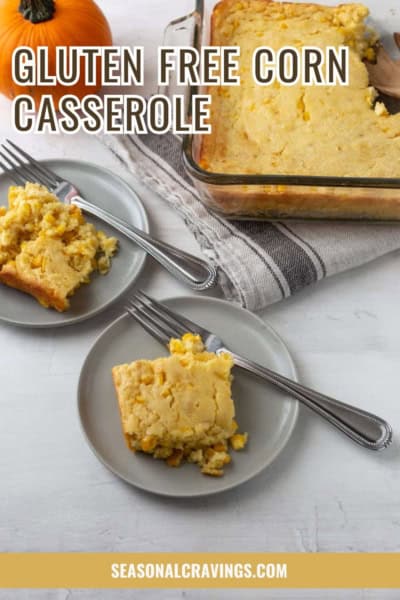 A serving of gluten-free corn casserole is placed on a gray plate with a fork. A larger dish of corn casserole sits nearby on a striped cloth. The text "Gluten Free Corn Casserole" is overlaid at the top.