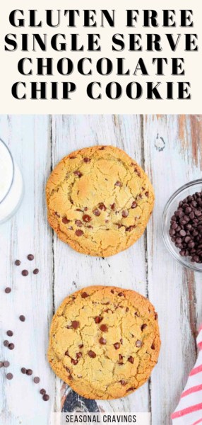 Two gluten-free chocolate chip cookies rest on a wooden surface. A bowl of chocolate chips and a glass of milk are partially visible at the edges. Text at the top reads "Gluten Free Single Serve Chocolate Chip Cookie." Enjoy this delightful, guilt-free treat!