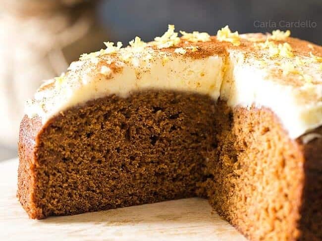 Slilced Gingerbread cake on a wooden board.