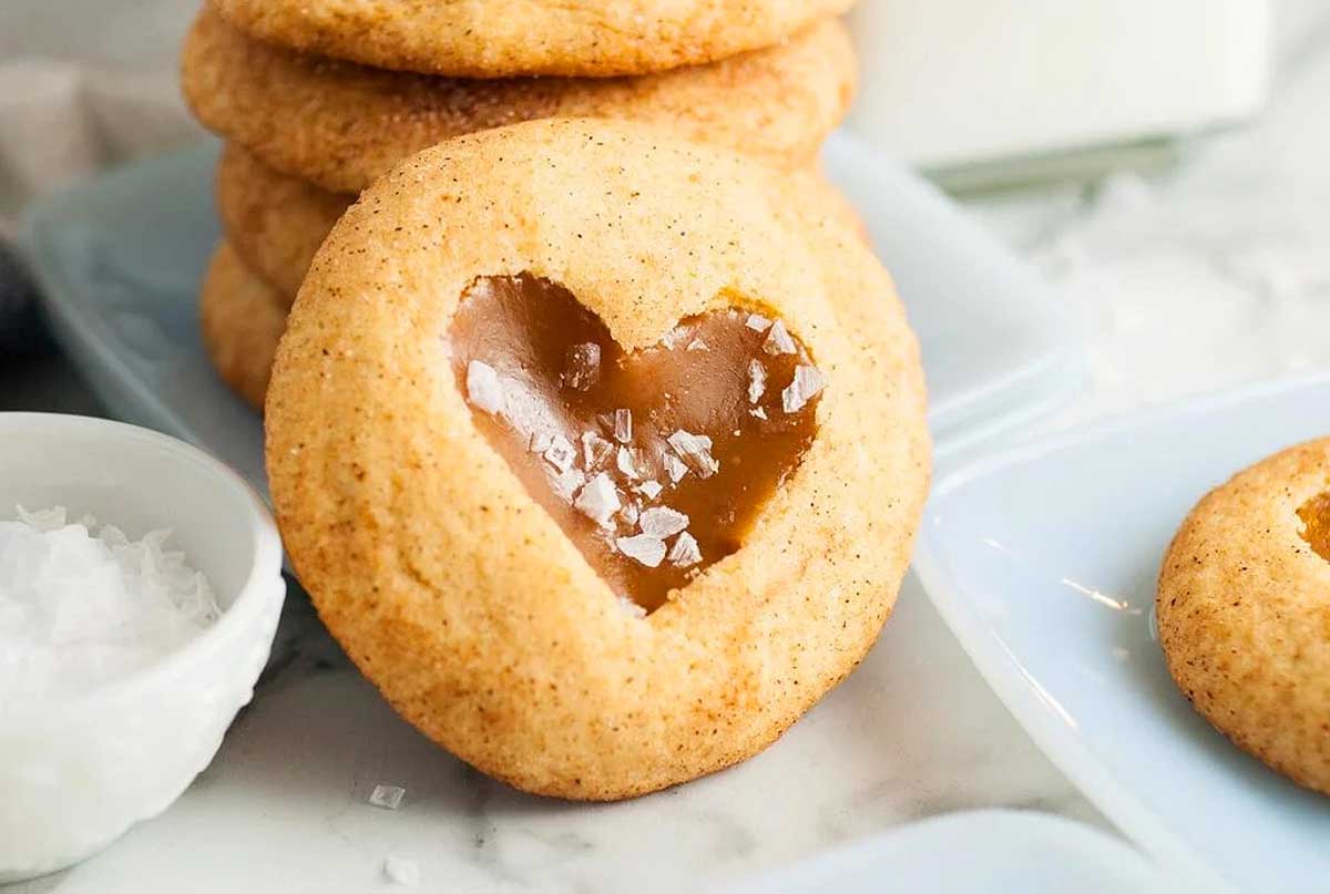 A plate of cookies with a heart in the middle.