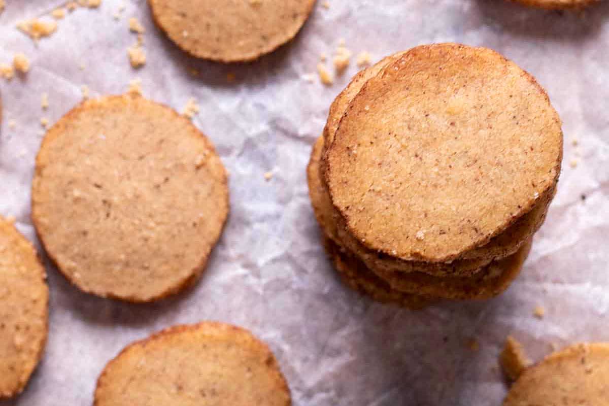 A pile of cookies on a piece of parchment paper.