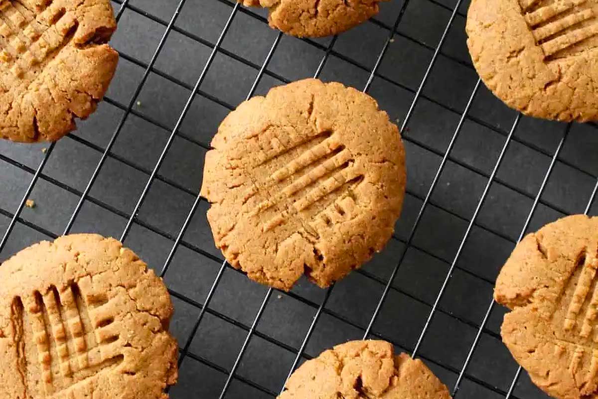 Peanut butter cookies on a cooling rack.