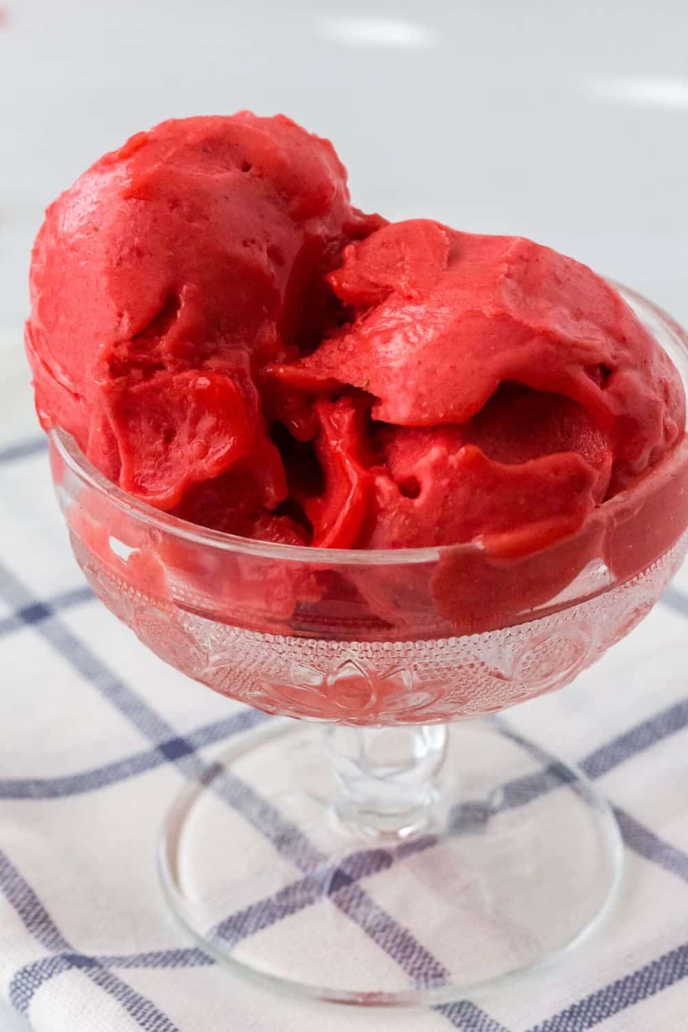 Ninja creami strawberry sorbet in a glass bowl.