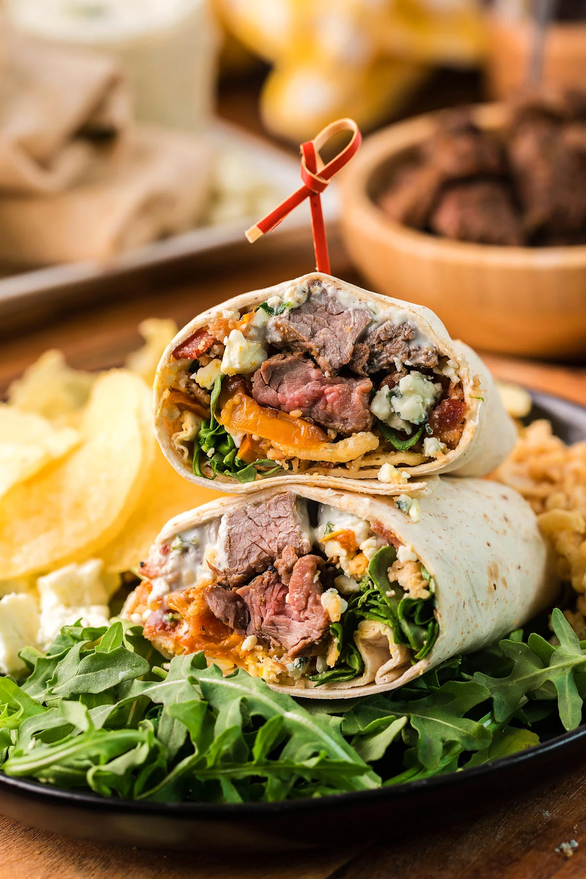 A chuck steak burrito served on a plate.