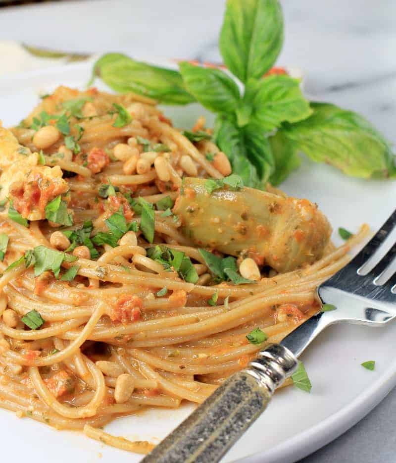 plated pasta on a white plate with a fork.