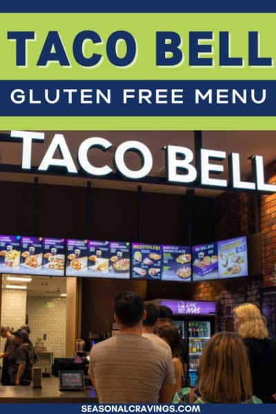 People standing in line at a Taco Bell counter, with visible menu boards above displaying the offerings. The image has a text overlay promoting the Taco Bell gluten-free menu from seasonalcravinging.com.